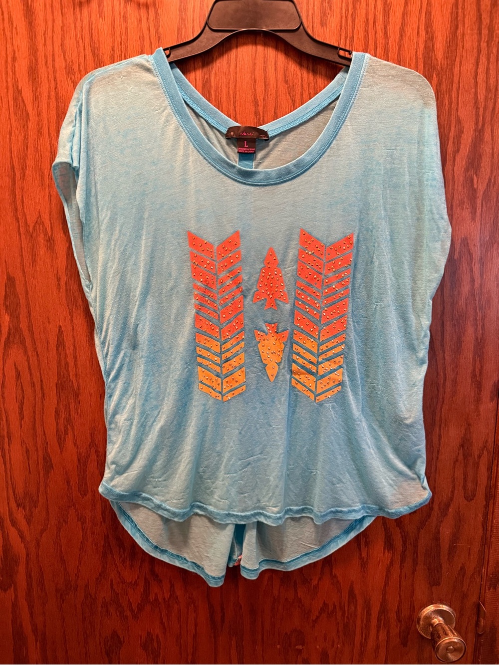 Light Blue Women's Graphic Tee with Orange Arrow Design